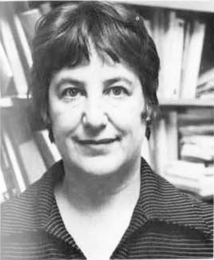 Image of Lisa Gumpel in front of a bookshelf
